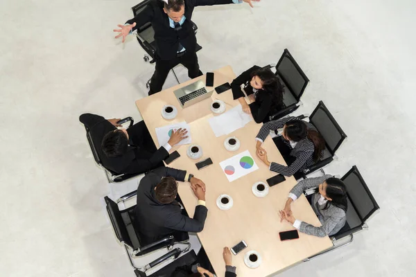 Team leader encourages people in team at meeting table . Executive manager gives command to office workers in group conference . Business teamwork motivation and aspiration concept.