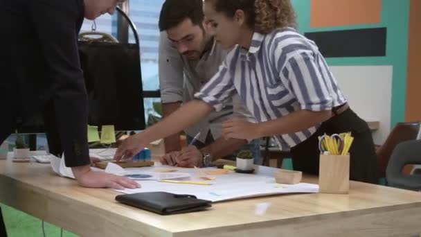Creative business people group having conversation at office desk in workplace. — Stock Video