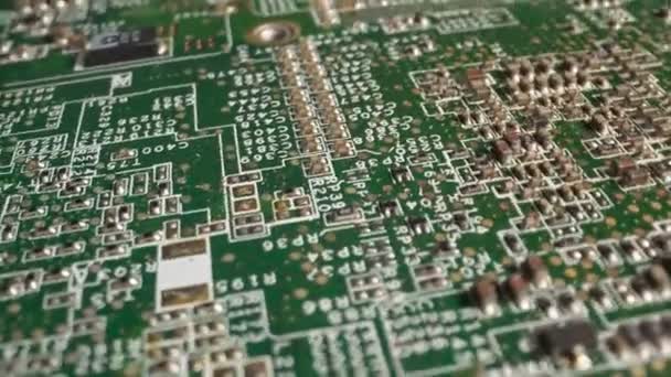 Extreme close-up of green Printed Circuit Board Electronics shot with dolly — Stock Video