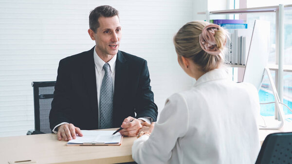 Job seeker in job interview meeting with manager and interviewer at corporate office. The young interviewee seeking for a professional career job opportunity . Human resources and recruitment concept.