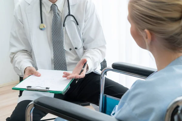 Doctor in professional uniform examining patient at hospital