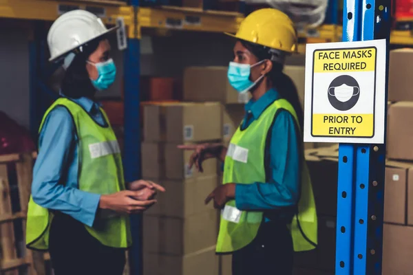 Caution sign in factory warning to industry labor worker to prevent Covid-19