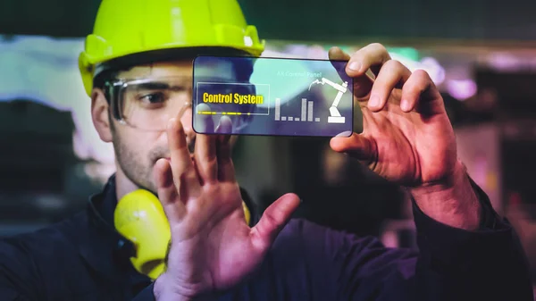 Factory worker use future holographic screen device to control manufacturing