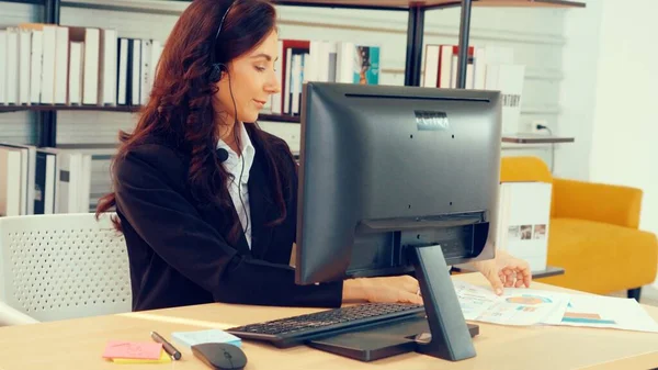 Business people wearing headset working in office — Stock Photo, Image