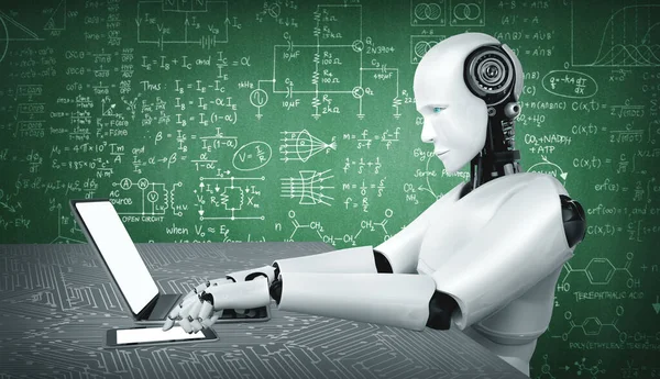 Robot humanoid használata laptop és üljön asztalhoz mérnöki tudomány tanul — Stock Fotó