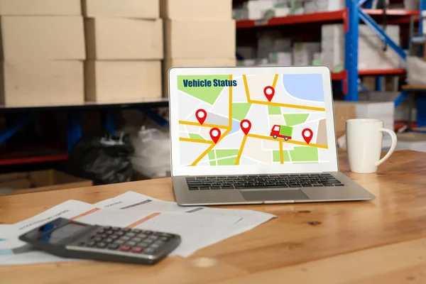 Warehouse management software application in computer for real time monitoring of goods package delivery . PC screen showing smart inventory dashboard for storage and supply chain distribution .