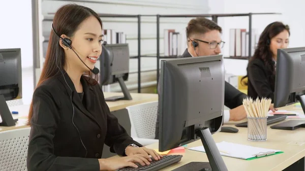 Business people wearing headset working in office — Stock Photo, Image