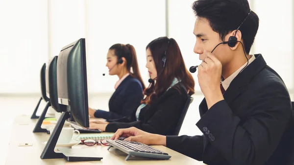 Business people wearing headset working in office — Stock Photo, Image