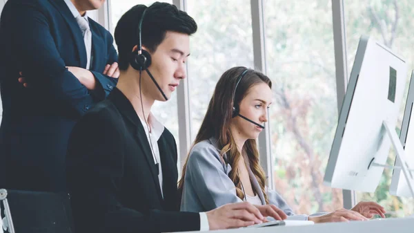 Business people wearing headset working in office — Stock Photo, Image