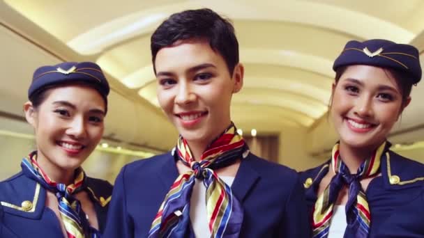 Group of cabin crew or air hostess in airplane — Stock Video