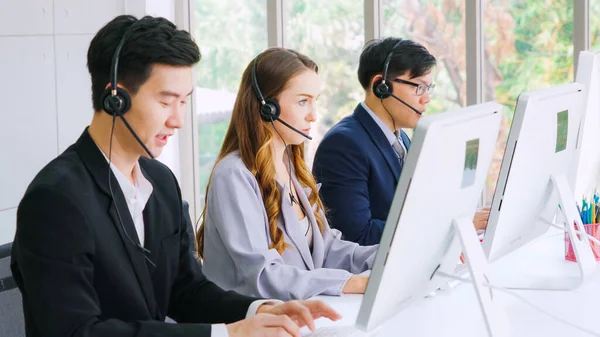 Business people wearing headset working in office — Stock Photo, Image