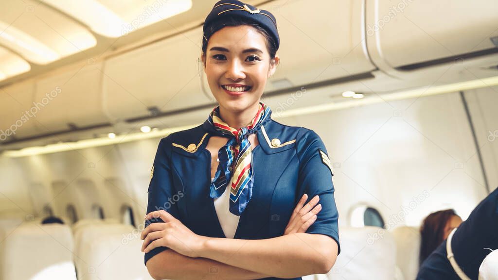 Cabin crew or air hostess working in airplane