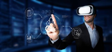A business professional wearing virtual reality glasses interacts with digital tools to boost productivity and drive performance in a modern office setting. XDMCP