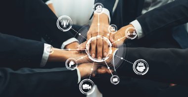A professional group of hands united in collaboration, showcasing teamwork with digital icons symbolizing networking and partnership in a corporate environment. Amity
