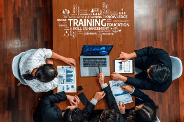 A dynamic group of professionals collaborate in a meeting, focusing on training and skill enhancement, utilizing analytics to drive informed decisions and growth. Amity