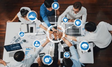 A dynamic business meeting showcasing teamwork and technology, with professionals engaged in collaboration to enhance management strategies and data-driven decision-making. Amity