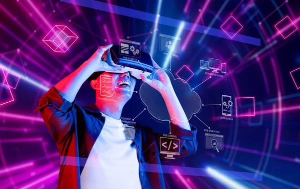 A developer joyfully engages with virtual reality technology in a vibrant digital landscape, highlighting the intersection of online services and cloud computing solutions. XDMCP
