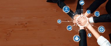 A diverse team showcases collaboration and innovative ideas in a professional workspace, emphasizing technology and CRM solutions to drive creativity and success. Amity