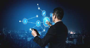 A business professional interacts with a digital interface, depicting data connections against a modern urban skyline, symbolizing innovation and technology. Tessel