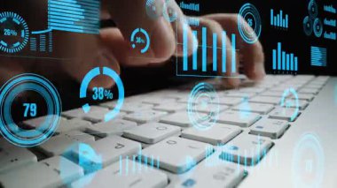 A close-up view of hands typing on a sleek keyboard, surrounded by transparent digital graphs and data visualizations, showcasing modern technology and analytics. Xenic