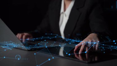 A focused professional woman types on a laptop while surrounded by floating data visualizations, charts, and graphs, representing modern business analytics and insights. Xenic