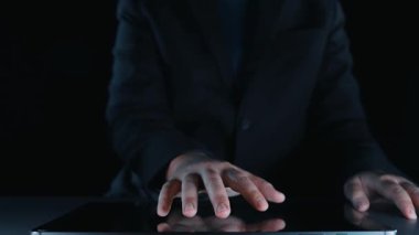 A striking image showcasing a hand reaching out to interactive arrows representing quality and cost dynamics on a digital surface, highlighting business analysis and decision-making. Qubit