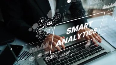 Business Professional Working on Laptop with Smart Analytics Data Visualization Interface Displayed on Screen. Asymptotic smart data analytic.