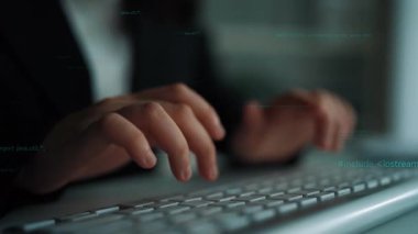A close-up of hands typing on a keyboard, surrounded by glowing code snippets. This image captures the essence of software development and coding in action. Xenic