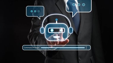 A businessman interacts with a virtual AI chatbot graphic, illustrating command prompt engineering in digital communication, highlighting innovation in user experience. XDMCP