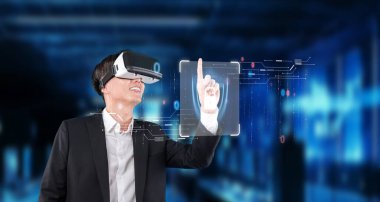 A businessman using virtual reality technology for cybersecurity and data protection, illustrating the intersection of digital innovation and safety in modern business environments. XDMCP