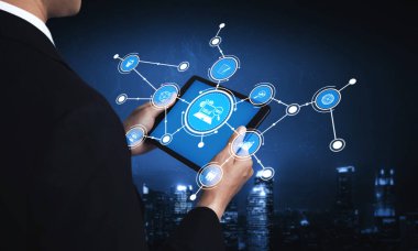A business professional engages with a tablet displaying digital connection icons, set against a vibrant city skyline, symbolizing technology and networking. Tessel