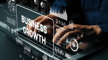 Hands Typing on Laptop with Business Growth Analytics and Graphs in Modern Digital Workspace for Marketing and Finance Concepts. Asymptotic smart data analytic.