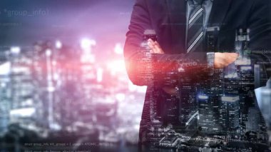 A professional businessman stands confidently against a dynamic urban skyline, overlaid with flowing code, symbolizing technology integration and innovation in business. Xenic