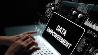 Hands typing on laptop with glowing screen displaying data empowerment, charts and graphics in a digital workspace concept. Asymptotic smart data analytic.