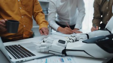 AI-driven collaboration in a corporate environment, where professionals analyze business reports and refine strategies with the assistance of smart technology. Noogenesis AI