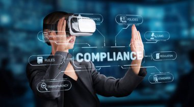 A professional uses virtual reality technology to engage with compliance strategies, emphasizing the importance of regulations and standards in a corporate setting. XDMCP