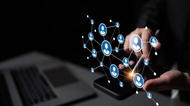 A person interacts with a smartphone displaying digital network connections, symbolizing modern communication and interaction in a technology-driven world. Tessel