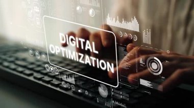 Hand Typing on Keyboard with Digital Optimization Concept Displayed on Screen in Modern Office Environment. Asymptotic smart data analytic.