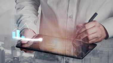 A business professional reviews market growth data on a tablet, showcasing modern graphs and charts that represent success, progress, and strategic planning in finance. Copula