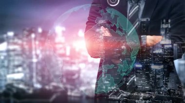 A professional businessman stands with arms crossed, overlooking an illuminated cityscape, enhanced by graphics representing digital innovation and strategic growth. Xenic