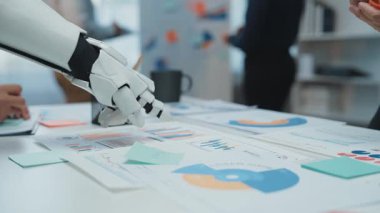 A futuristic office where AI-powered analytics support professionals in refining financial performance and corporate planning. Noogenesis AI