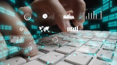 A conceptual image depicting hands typing on a keyboard with floating digital graphics representing data analysis, statistics, and modern technology interaction. Xenic
