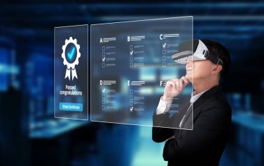 A businessman engaged with virtual reality technology examines a quality management system concept, celebrating success with a digital certificate in a modern office setting. XDMCP
