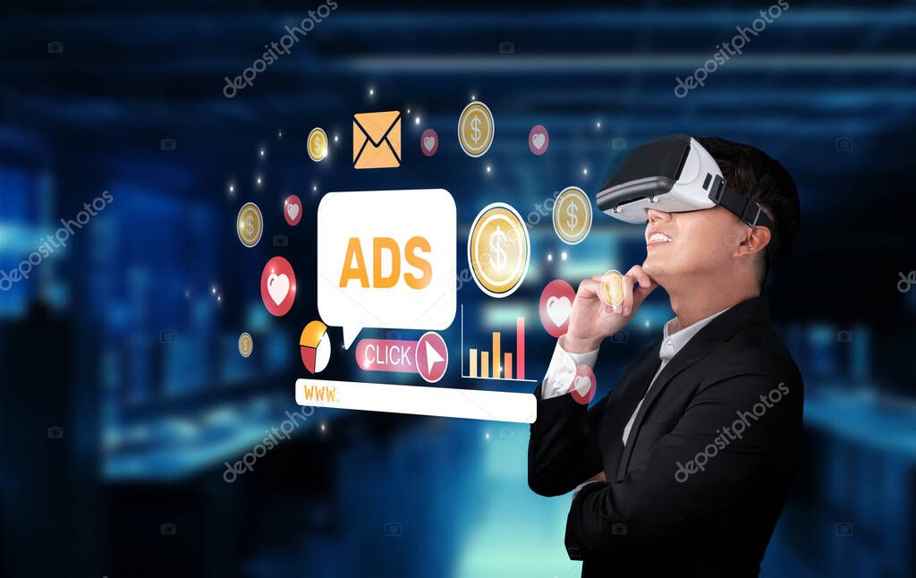 A businessman wearing virtual reality glasses interacts with advertising elements in a modern digital workspace, highlighting the innovative trends in online marketing strategies. XDMCP