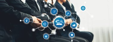 A group of business professionals in formal attire participating in a conference, surrounded by technology and networking icons, highlighting collaboration and innovation. Amity