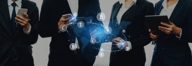 Group of business individuals interacting with digital devices while discussing cryptocurrency trends, symbolizing the future of finance and technology integration. Trope