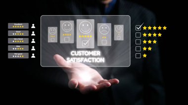A professional hand displaying a holographic interface showcasing customer satisfaction ratings with emoticons and stars, symbolizing modern feedback systems. Qubit