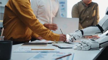 AI-powered tools assisting business consultants in data-driven decision-making, symbolizing the increasing impact of artificial intelligence in work environments. Noogenesis AI