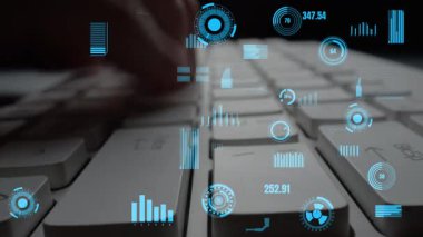 A close-up shot showcasing hands typing on a keyboard while surrounded by an overlay of digital graphs and metrics, representing modern technology and data analysis. Xenic