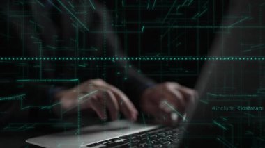 Close-up view of hands typing on a laptop in a low-light setting, showcasing a professional environment ideal for technology or business-related themes. Xenic